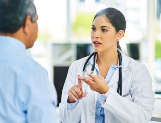 Clinician discussing Spravato and IV ketamine treatment options with a patient during consultation